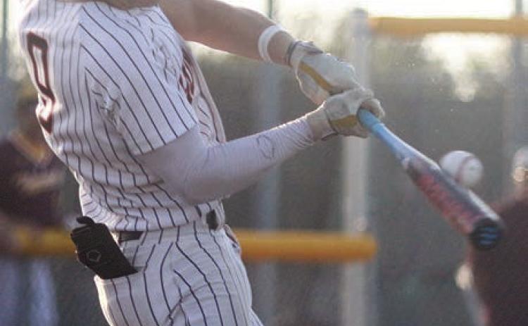 Jayse Janda connects for the first of his seven hits in the series. Sticker Photo By Darrell Vyvjala