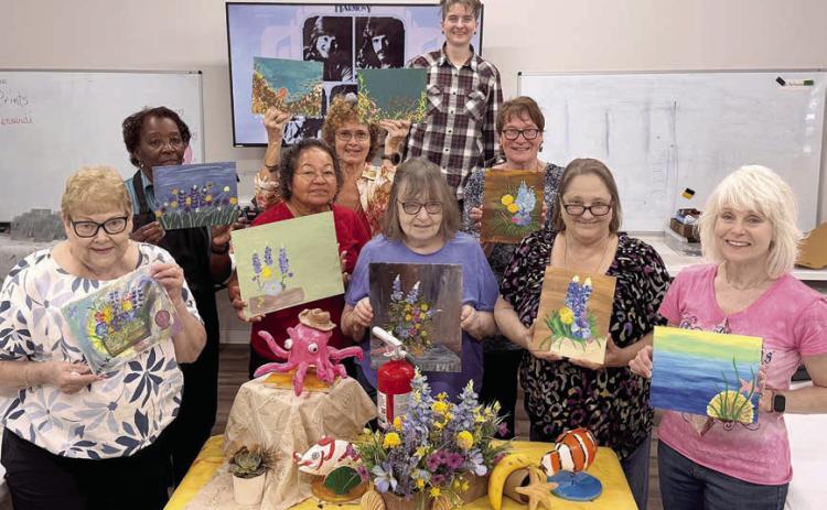 In Jaime Janda’s Artful Friday class, students were tasked to paint a still life. Whether they chose to focus on one small section or a large portion of the display, each created something very individual and unique. Shown are (from left) Maxine Farley, Deborah Jones, Amparo Salinas, Nancy Hillary, Verna Lenth-front, Jaime Janda, Berni Gillings, Sharon Friedrich and Kim Penland.