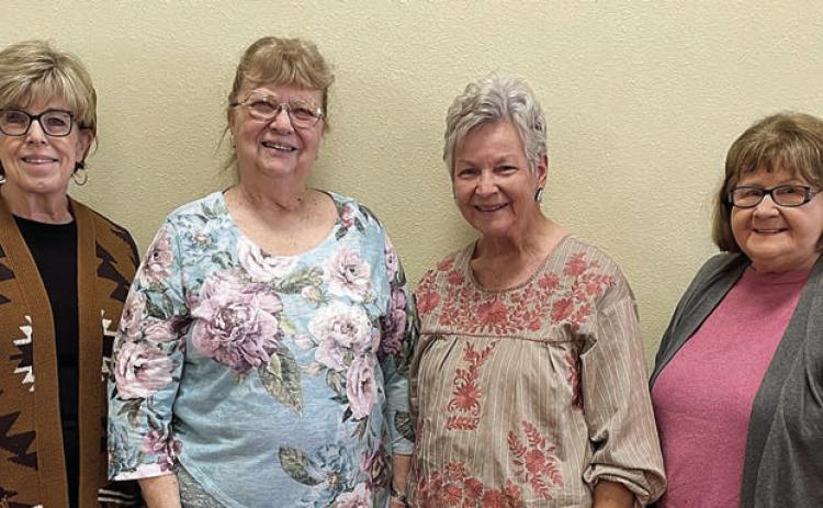 The Fayette County Extension Education Association was represented at the District 11 Spring Conference by (from left) Sally Garrett-Fayette County Extension agent for family and community health, Janice Alexander, Lila Garlin and Helen Wagner.