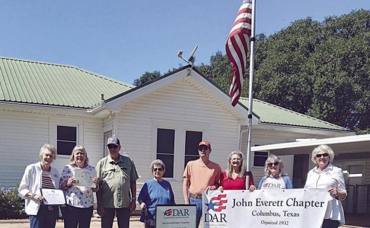 Daughters of the American Revolution and Sons of the American Revolution members on hand to present the monthly recognition for the U.S. flag display to Audrey Meyer Smyth (second from left) were (left) Judy Zachmeyer, (continuing after Smyth) David Zachmeyer, Nelma and Glen Strey, Donna Pustejovsky, Jana Semler and Connie Dittrich.