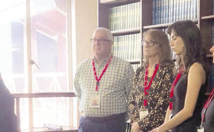SHOWN At the swearing-in on July 29 for new CASA volunteers are (from left) Benton Eskew, court at law judge, who swore in Scott Davis of La Grange, Becky Herrin of Bastrop, Mary Jo Kilpatrick of Cedar Creek and Pamela Quarles of Elgin.