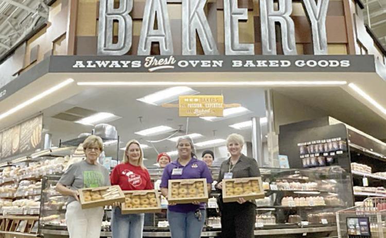 Sho wn with doughnuts donated by La Grange H-E-B for distribution to Fayette County first responders are (from left) Sally Garrett and Krystal Seger, Fayette County Salvation Army Chapter board members who distributed them; Claudia Reyes, HEB bakery manager; and Liz Barta, HEB top store leader.