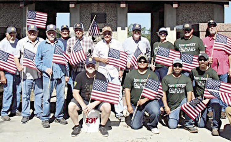 Legion, other groups place flags on veterans’ graves for Memorial Day