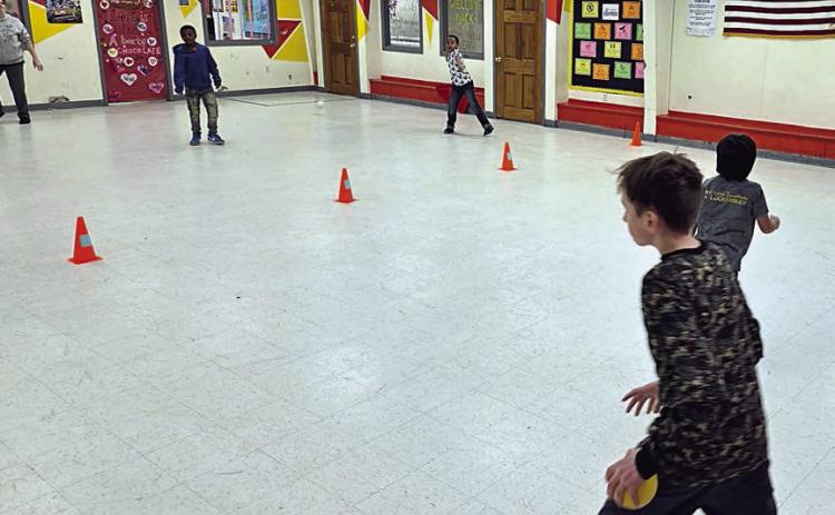 Members of the Schulenburg Unit of the Boys & Girls Club love a good game of dodgeball! Members are encouraged to get active and dodgeball does just the trick. Shown are (front, from left to right) Club members Michael Muras and Angel Reyes, (back, from left to right) staff member Megan Pledger and Club members Dredyn Wright and Adonis Thomas.