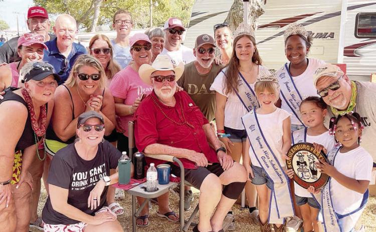 Local Chili 1st Place – “Team Baumgarten” - Jim Baumgarten (seated), who has competed in the Festival cookoff for 40 years, along with family and friends. Also shown presenting the award are Miss Schulenburg and her court. Sticker Photo By Brandt Vyvjala