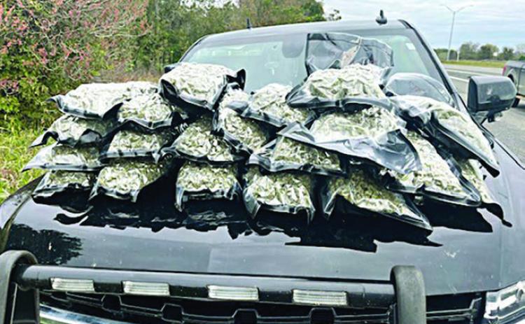 AFTER a traff ic stop on I-10 near Flat onia, 20 sealed bundles of high-grade hydro marijuana were located in a trash bag in the rear cargo area of a 2018 GMC Acadia.