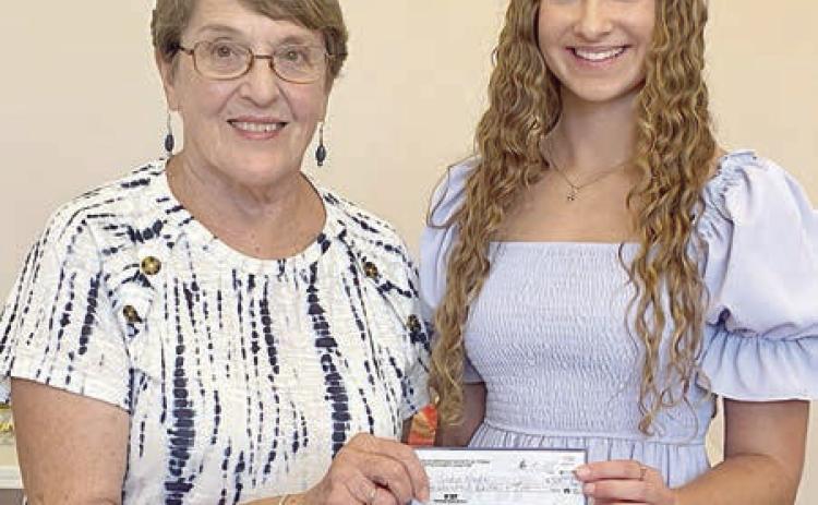 PHOTO ABOVE – The CHS scholarship check is being presented to Sadie Noska (right), 2025 Flatonia High graduate, by Carolyn Heinsohn (left). PHOTO AT RIG HT – Competing in pageants this year are both Texas CHS State Queen Madelyn Karstedt (left) and Fayette County CHS Little Princess Lillie Karstedt (right).