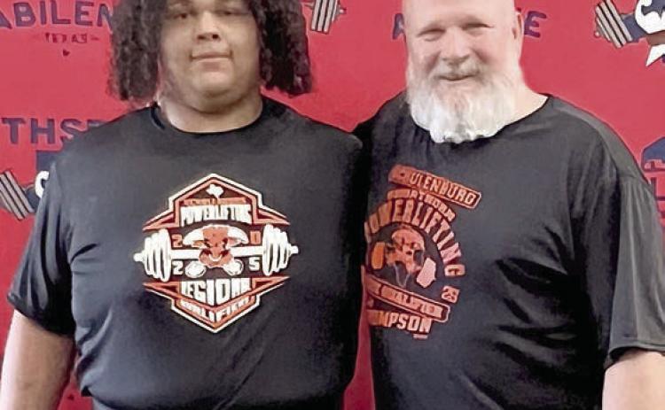 Calvin Thompson (left) poses with SHS powerlifting coach Brad Oden at the THSPA Division 4 state meet.