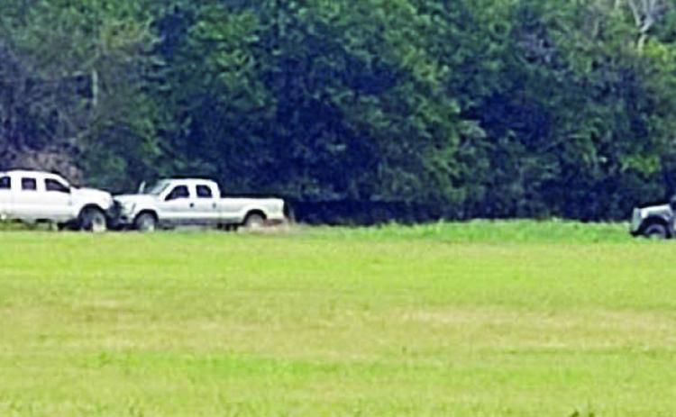 Members of the Austin County Regional Special Response Team approach the stolen vehicle and trailer. Photo Courtesy of the Fayette County Sheriff’s Department