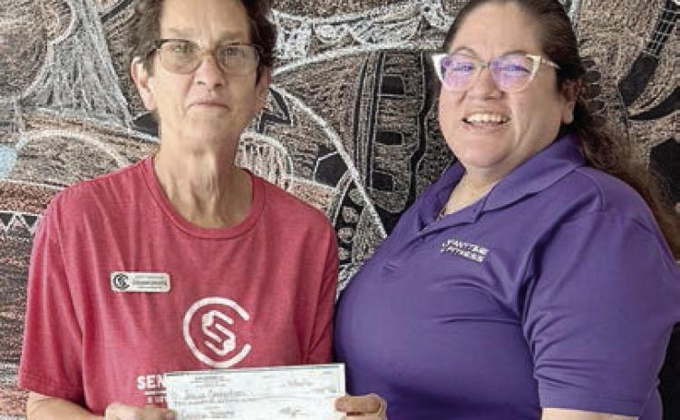New registration fees for April were donated by Anytime Fitness.Program director Stephanie Shroyer (left) received the donation from Amanda Brown (right). Senior Connections is so grateful to Anytime Fitness for this kind gesture.