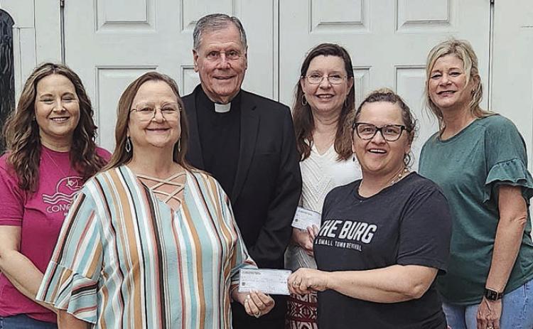 St. Anne’s Society presents donations
