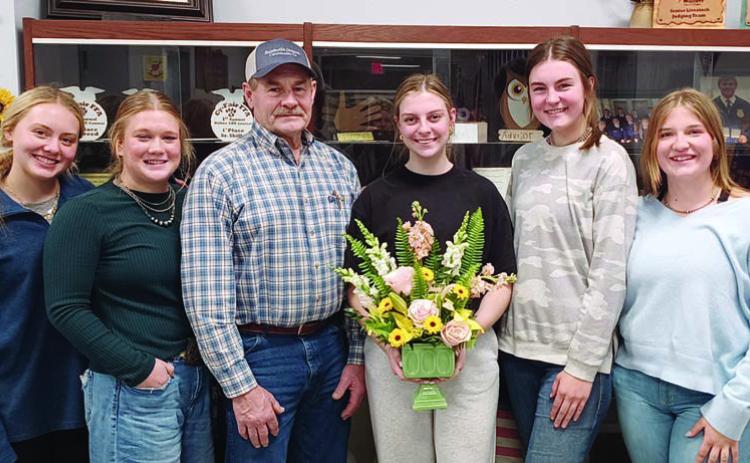 Floral design and shop show results was part of the program given by Schulenburg FFA officers at the Young Farmers meeting. Shown are (from left) Keeley Warnken and Haley Schramek, FFA’ers; Mark Vecera, Young Farmers president; and Kaylee Beyer, Madyson Holub and Kyrroll Prihoda, FFA’ers.