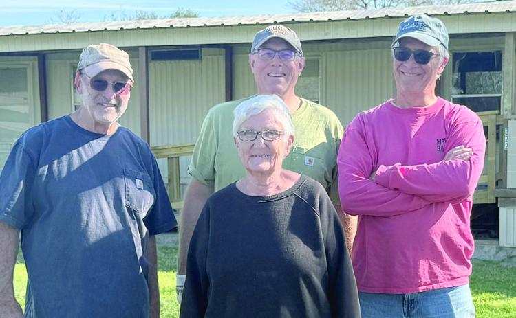 An Aging in Place project was recently completed by Fayette County Habitat for Humanity to benefit Bennie Lou Liere (front). Also shown are Habitat volunteers (back, from left) Steve Hardin, Matt Holdeman and Doug Elliott.