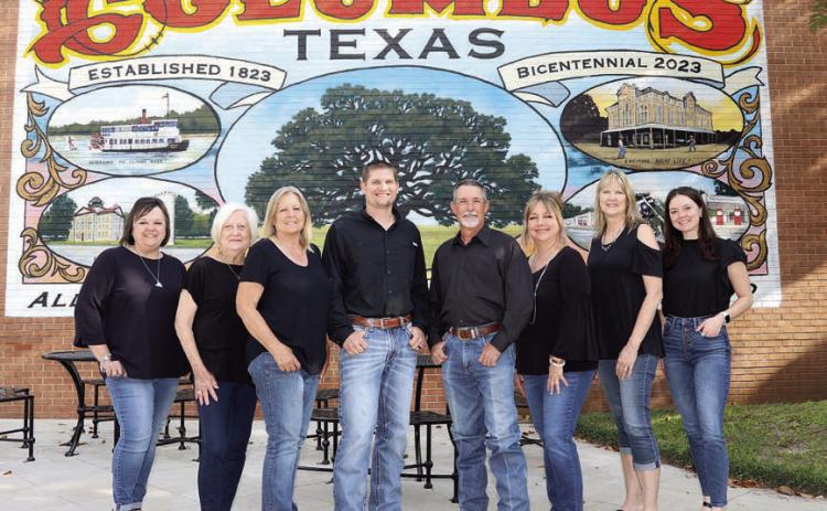 Double G Realty Group – (from left) Michelle Courtney, Linda Woodward, Penny Henske, Dustin Helmcamp, Troy Goolsby, Jolyn Goolsby, Melanie Appelt and Mary Courtney.
