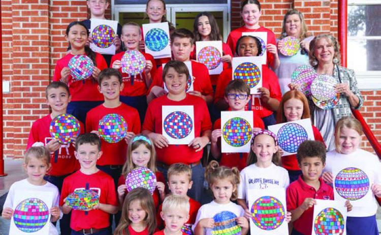 A disco ball theme helped promote the Parents As Teachers Day observance, and area students were asked to decorate disco ball artwork. Shown are St. Rose of Lima Catholic School students displaying their creations.