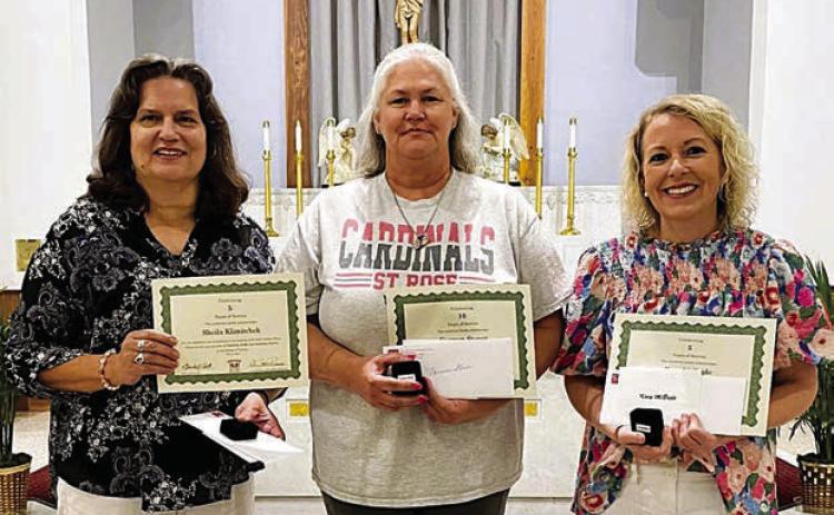 St. Rose of Lima Catholic School presented service milestone awards on Thursday, May 16 to three staff members – (from left) Sheila Klimitchek, grades 3-4 teacher, 5 years of service; Carmen Stoner, aide/cafeteria, 10 years of service; and Kacy McBride, grade 1 teacher, 5 years of service. St. Rose thanks all teachers and staff for their dedication and service to the essential resource for our future – children.