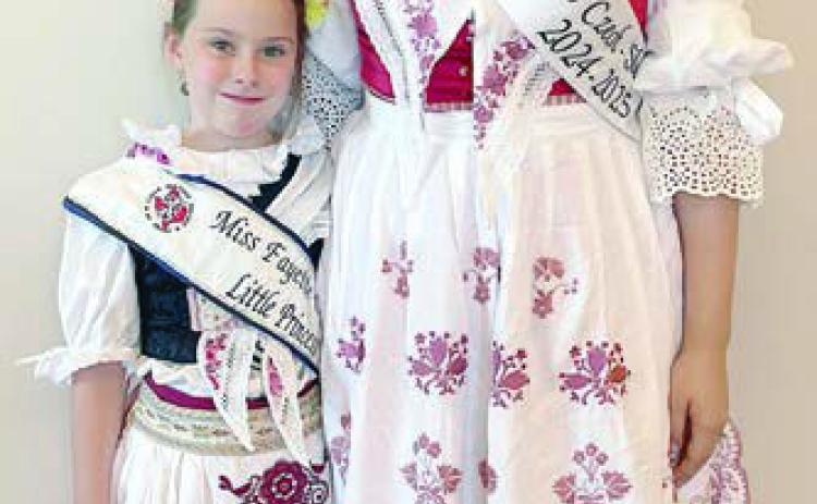 Wearing Czech Krojs are (from left) Fayette CHS Little Princess Lillie Karstedt and CHS Miss Texas Czech-Slovak Queen Madelyn Karstedt. The traditional Czech costumes were made by their mother, Bonny Karstedt.