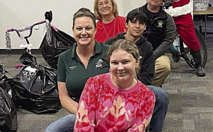 Shown during last year’s Deputy Santa Program toy distribution in Schulenburg are: (front to back) Emilie Fowler, Sgt. Angela Lala, Jesse Pardo, Nettie Cernosek, Investigator Kenn Kretz, and Santa (Deputy Jason Fowler).