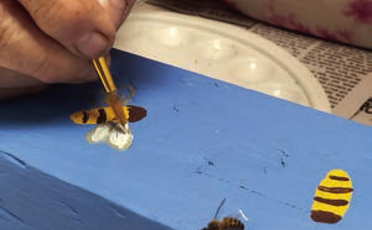A bee served as guest model for pole painting being done by Berni Gillings.