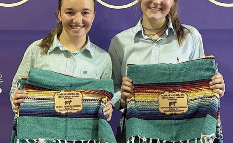 Swine – grand champion Madyson Holub (right) and reserve champion Mikayla Otto (left).