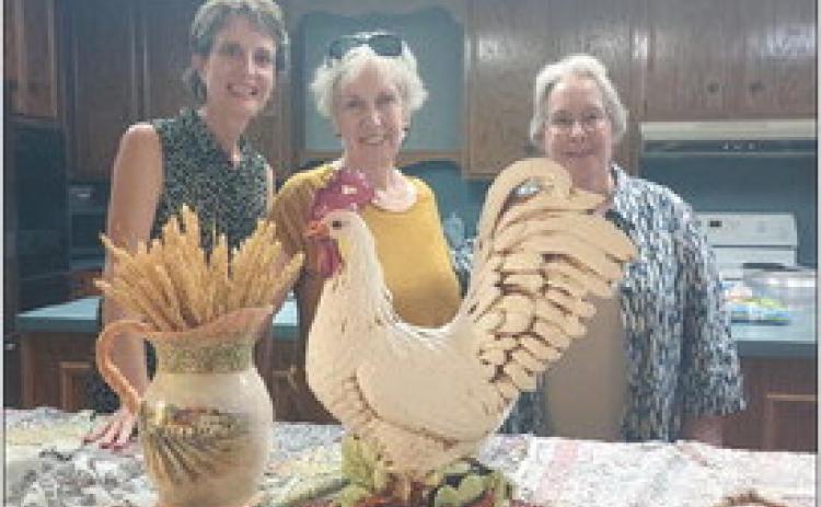Hostesses for the Garden Club meeting were (from left) Lisa Dennis, Carol Archer and Nancy Tinsley.
