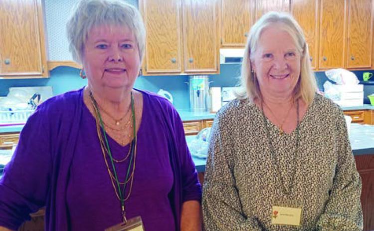 Hostesses were (from left) Bonnie Baker, Janet Murphy and (not shown) Carolyn Caflisch.