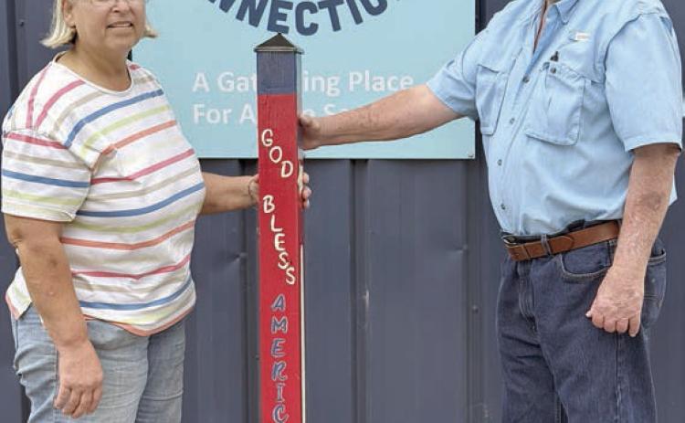 Thanks – As a token of appreciation to the City of Schulenburg, Senior Connections gifted this garden pole to Mayor Connie Koopmann (left) and City Council member Clarence Ahlschlager (right), both of whom are members of the Senior Connections board.