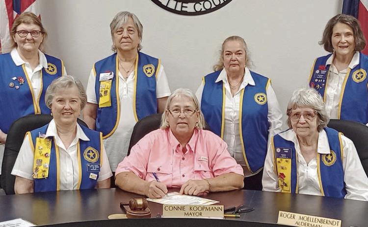 A proclamation designating May 23 as “Poppy Day” in Schulenburg was signed by Mayor Connie Koopmann in the presence of American Legion Auxiliary Unit 143 representatives. Shown are (front row, from left) Patricia Hranicky, Auxiliary vice president; Mayor Connie Koopmann; Peggy Fish, Auxiliary president; (back row) Dana Bartosh, Auxiliary member; Debora Behlen, treasurer; Sandi Guthrie, sergeant-at-arms; and Patricia Marty, historian.